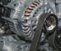 Car mechanic inspecting an alternator in Utah alternator repair shop