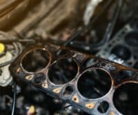 Professional technicians fixing a blown head gasket at Ace Auto Repair in Utah
