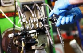 Auto Technician working on Fuel Injectors - Ace Auto Repair