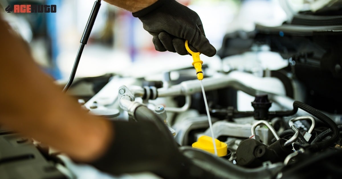 Certified mechanic performing a Honda oil change at Ace Auto Repair