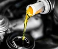 Cost of synthetic oil changes in West Jordan - Mechanic working on a car engine