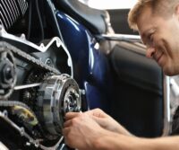Certified mechanic performing auto transmission repair at Ace Auto Repair Shop