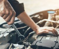 Auto technician diagnosing transmission in West Jordan UT