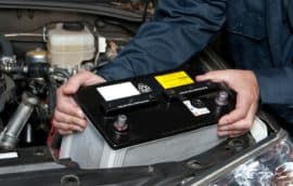 Mechanic replacing battery - Auto Repair in West Jordan, Utah