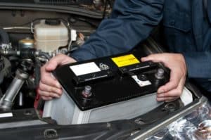 A Mechanic Replacing Battery - Battery Replacement and Maintenance Services in West Jordan - Ace Auto Repair