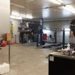 Vehicles on lift being repaired - Ace Auto Repair in West Jordan, Utah