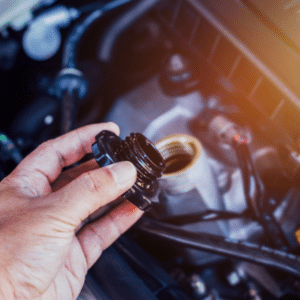Auto technician checking brake fluid during vehicle service
