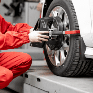 Mechanic explaining wheel alignment cost estimate to customer in Utah